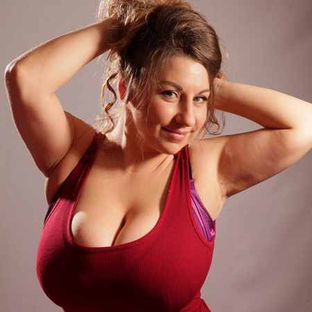 Samanta Lily pops her tits out of her red dress